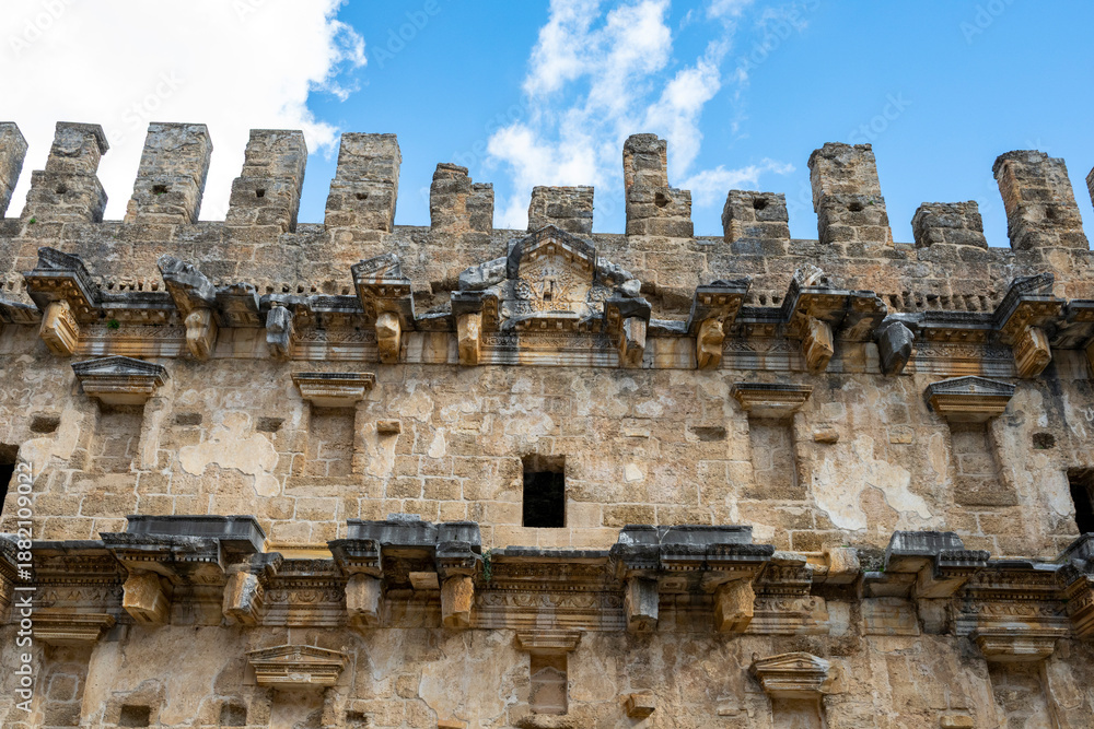 Fototapeta premium Aspendos Ancient Theater in Antalya, Turkey. Aspendus (Attic: Ἄσπενδος; Pamphylian: Εστϝεδυς) was an ancient Greco-Roman city in Antalya province of Turkey. The site is located 40 km east of the moder