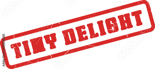 Red distressed rubber stamp impression displaying the delightful message Tiny Delight on a clean surface