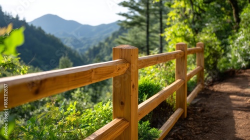 Beautiful Timber Railings Along Scenic Mountain Path Surrounded by Lush Greenery