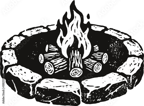 Camping fire pit with burning wood logs and stone circle surrounding outdoor campfire