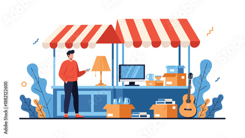 Young man in a red sweater stands next to an outdoor market stall selling various used items like a lamp, monitor, and guitar.