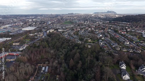 Panoramic aerial view of Edinburgh cityscape with the iconic Arthur's Seat hill in the background, Scotland