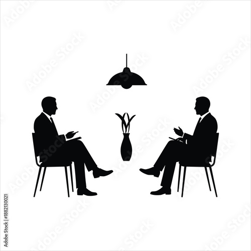 two silhouetted men in suits seated facing each other in a meeting setting