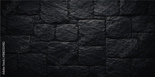 An abstract pattern of ancient masonry features a rough textured surface of solid black and white stone blocks and weathered brick construction for a dark architectural wallpaper