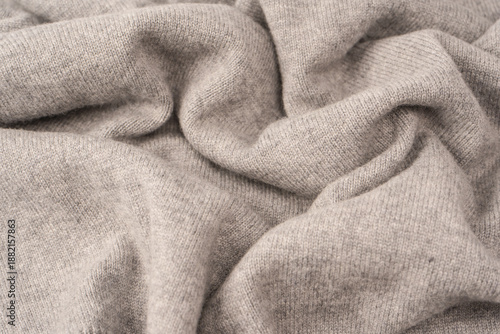 Soft grey merino wool sweater texture as a background.
