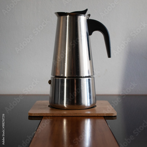 Italian coffee maker on a board on the table