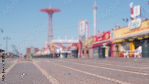 Wallpaper Mural Coney Island beach promenade in Brooklyn, New York, United States. Wooden boardwalk near retro luna park. Amusement park on ocean coast beach. Waterfront summer holiday, people walking on promenade. Torontodigital.ca
