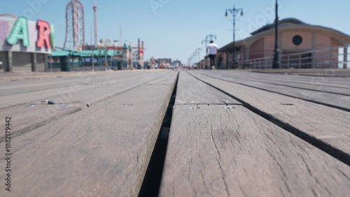 Wallpaper Mural Coney Island beach promenade in Brooklyn, New York, United States. Wooden boardwalk near retro luna park. Amusement park on ocean coast beach. Waterfront summer holiday, people walking on promenade. Torontodigital.ca