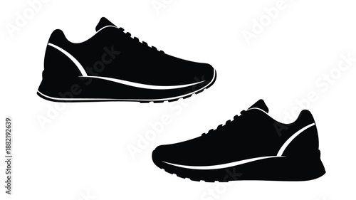 Two black running shoes depicted in a striking dark silhouette