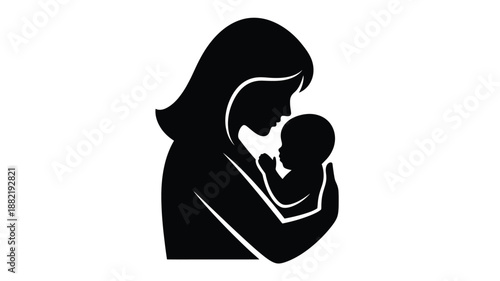 A tender moment mother holding baby in a dark silhouette