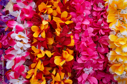 Closeup of colorful, vibrant, artificial leis for sale in Kona on the Big Island of Hawaii
