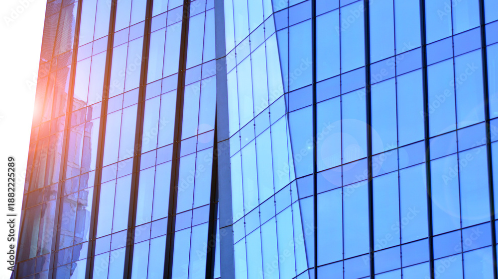 Fototapeta premium Modern office building exterior made from glass and steel. Windows of office building. Abstract architectural concept with sunlight. 