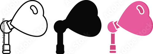 Heart shaped lamp in outline black and pink colors light illumination