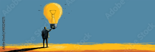 Businessman reaching for a glowing light bulb, symbolizing new ideas and innovation. Businessman holding light bulb representing creative idea