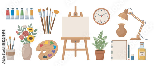 Artist's studio collection of supplies featuring a wooden easel with a blank canvas, paint tubes, various brushes, a palette, a sketchbook, and a desk lamp for creative work