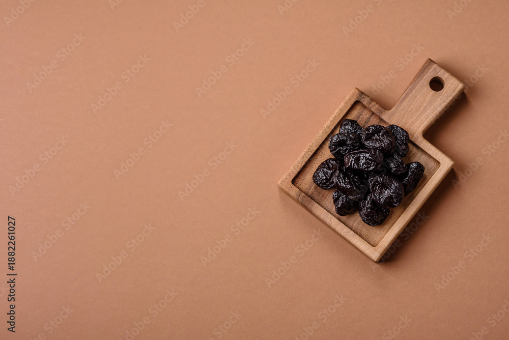 Fototapeta premium Sweet dried plums or prunes, organic dehydrated fruit for dietary nutrition. Prunes or dried plums