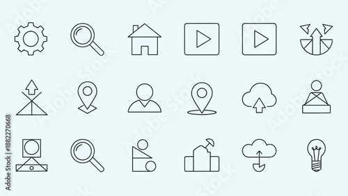 A professional photographer capturing a high-angle lifestyle shot of a creative workspace with a digital camera on a tripod in a bright modern studio