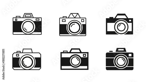 A professional photographer capturing a high-angle lifestyle shot of a creative workspace with a digital camera on a tripod in a bright modern studio