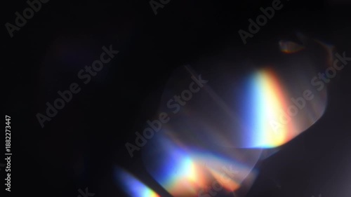 Cinematic lens flare light on black background, abstract optical glow and colorful bokeh overlay, perfect for transitions, titles, visual effects and creative video projects.