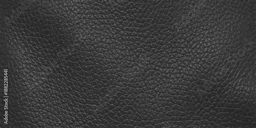 A macro shot of a dark black leather texture background featuring a natural rough skin pattern and textured material surface for a high-quality design wallpaper