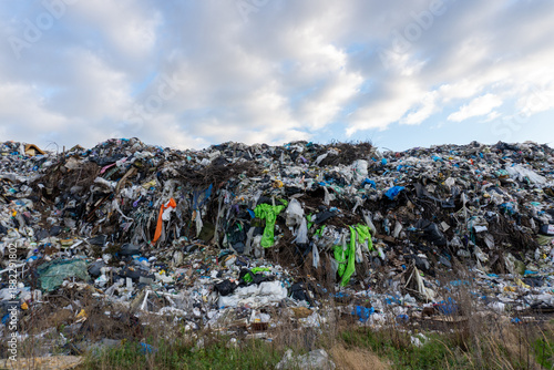 Photos Large pile of garbage seen in clear sky at waste disposal site in the afternoon