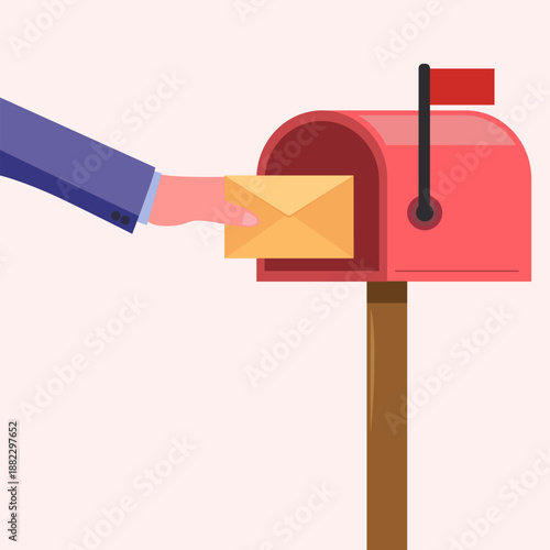 Hand holding yellow envelope inserting into mail box