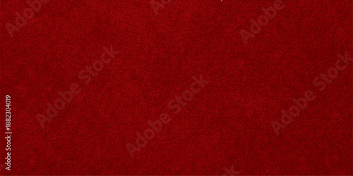 A dark red vintage paper and textured fabric background with a rough grunge pattern on a blank canvas surface for a Christmas textile wallpaper design