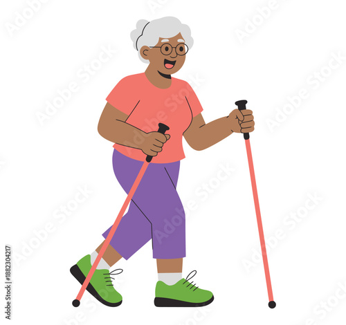 A senior woman enjoying a leisurely walk with trekking poles on a sunny day