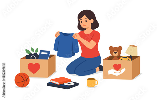 Young hispanic female organizing donation boxes with clothes and toys