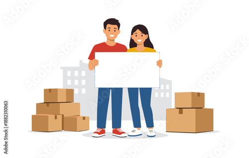 Young caucasian couple holding blank sign with moving boxes