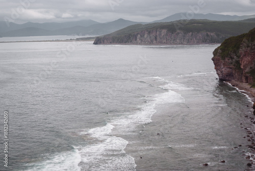 Hiking along the Sea of Japan coastline while traveling through the remote landscapes of Russia’s Far East region, adventure experience.