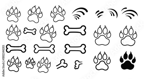 Hand drawn collection of dog paw prints and bones doodles.