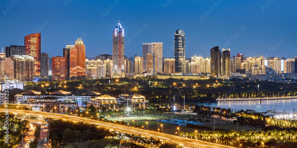 Fototapeta premium High angle night view of the Guomao CBD complex in Haikou, Hainan Island, China