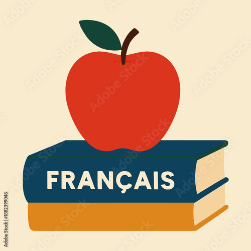 Red apple on a stack of French textbooks
