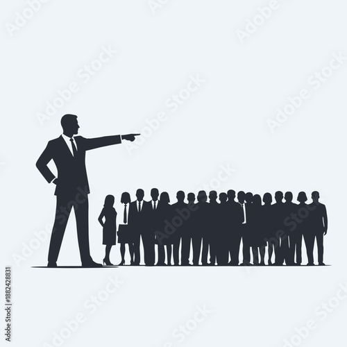 Business leader pointing to a group of employees.