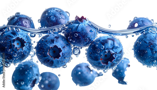 Close-up of vibrant blue berries submerged in crystal clear water, droplets clinging to their surfaces