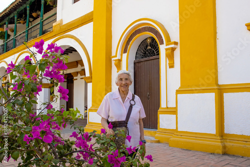 Wallpaper Mural Senior woman at the historical Church of the Immaculate Conception built in 1843 in the beautiful Heritage Town of Mompox in Colombia Torontodigital.ca