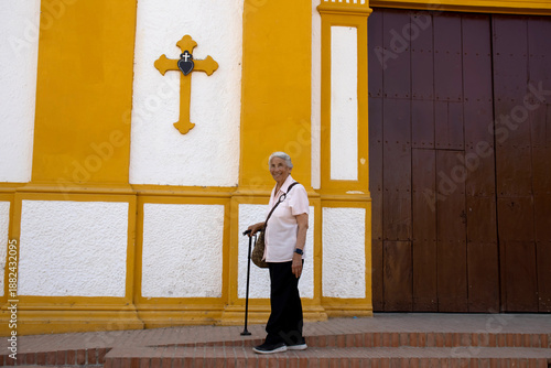 Wallpaper Mural Senior woman at the historical Church of the Immaculate Conception built in 1843 in the beautiful Heritage Town of Mompox in Colombia Torontodigital.ca