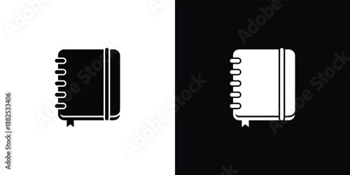 Two spiral notebooks with black and white covers on black background