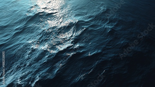 Ocean Surface Ripples with Sunlit Waves, Deep Blue Sea, and Natural Water Texture.