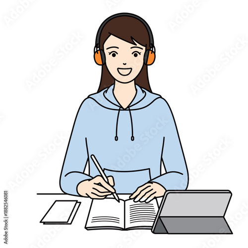 Smiling young woman wearing earmuffs studying with a notebook and tablet