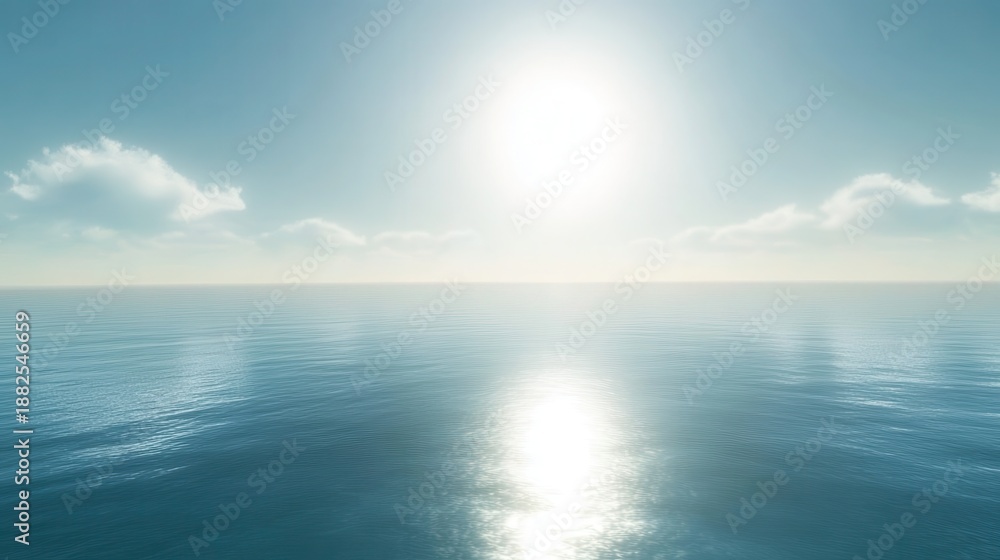 Fototapeta premium The brilliant sun shines intensely on the vast ocean surface with its reflection creating a bright path across the calm blue water and clear sky