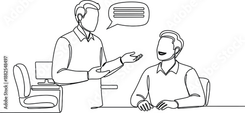 Man discussing with colleague in office setting .