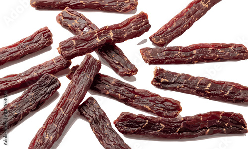 Traditional beef jerky meat sticks snack vector illustration isolated on white background for high protein diet, keto food packaging, and dried snacks.
