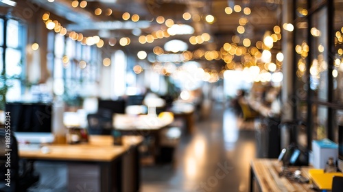 Cozy with blurred office interior with warm string lights and desks.