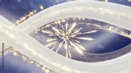 Abstract blue and white background with glowing lines and particles creating a dynamic effect.