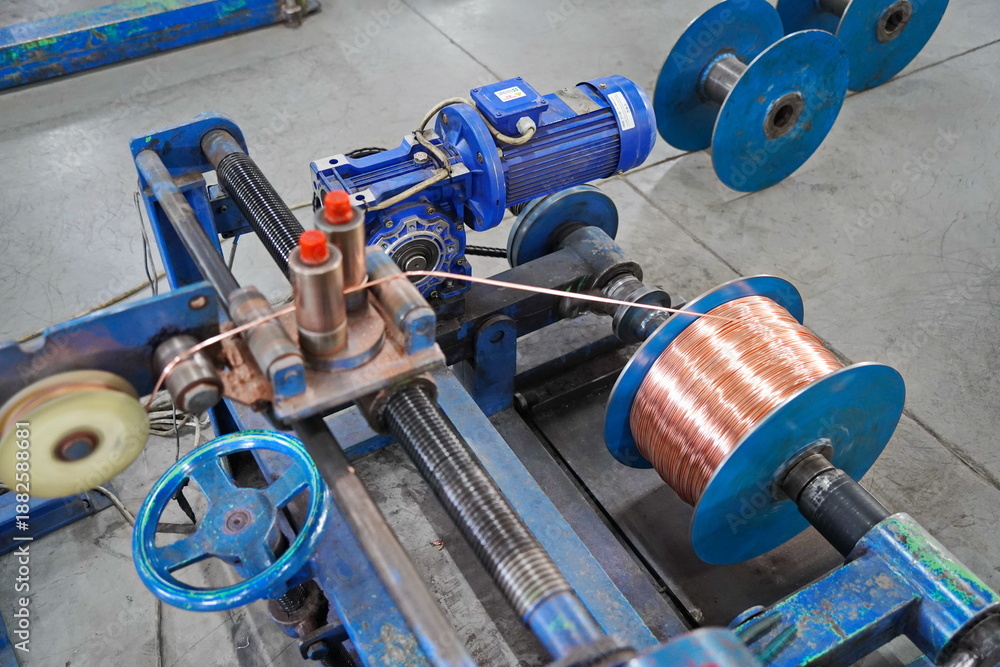 Fototapeta premium Coils with copper wire. Optical fiber production workshop.