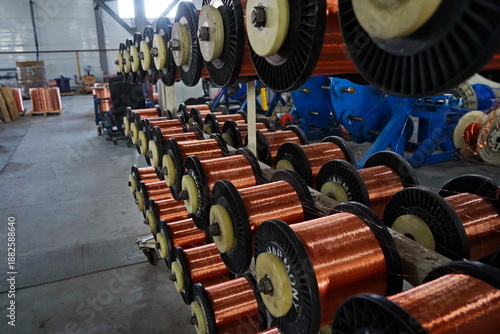 Coils with copper wire. Optical fiber production workshop.