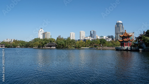 Urban Lake with Traditional Pavilions and Skyscrapers