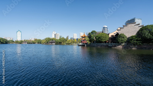Urban Lake with Traditional Architecture and Modern Buildings